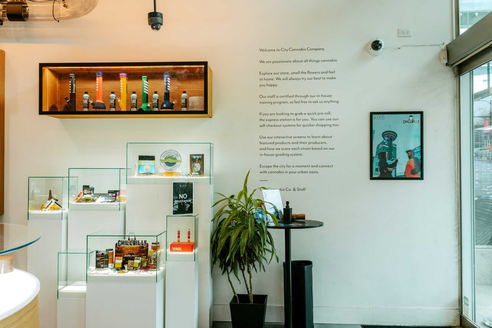 Interior of the City Cannabis Co. Cambie Street store with display tables and product shelving