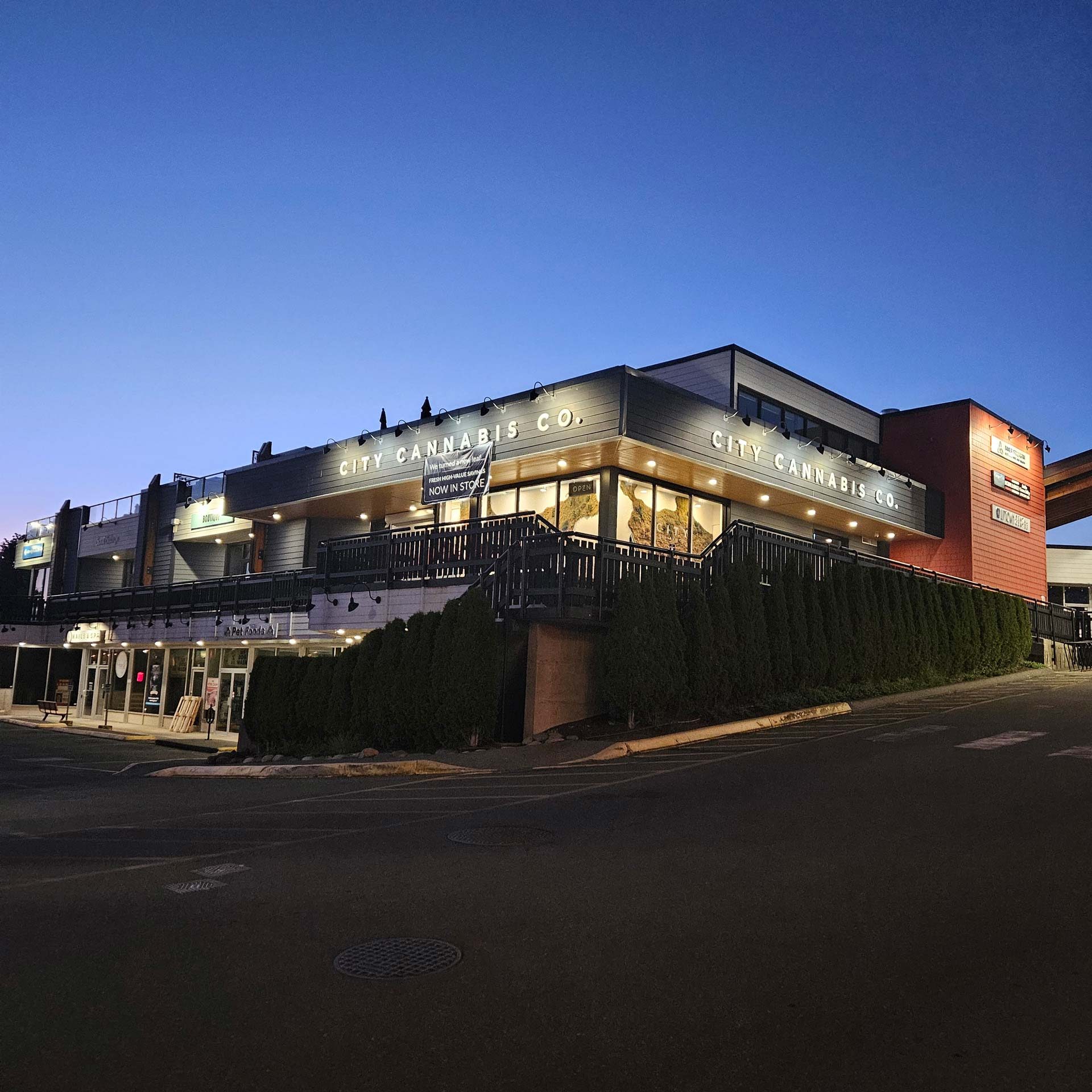 Exterior of the City Cannabis Co. Comox store at dusk